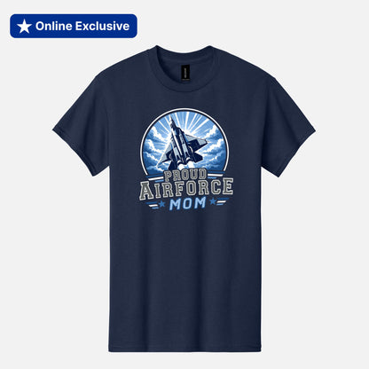 A navy blue short-sleeve t-shirt with a circular graphic on the chest featuring a fighter jet and the text 'PROUD AIRFORCE MOM' in white and light blue. The t-shirt is displayed on a light gray background with a blue 'Online Exclusive' banner in the top-left corner.