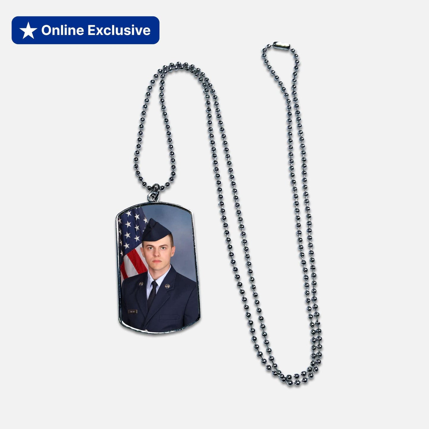 Dog tag necklace with a photo of a Airman in uniform and an American flag on a white background.